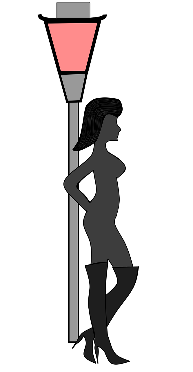 Sex worker against a streetlamp